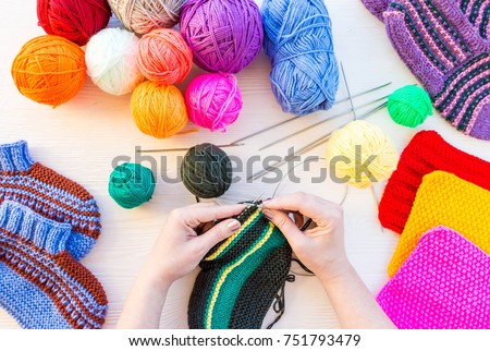 girl knits sock knitting needles on white background