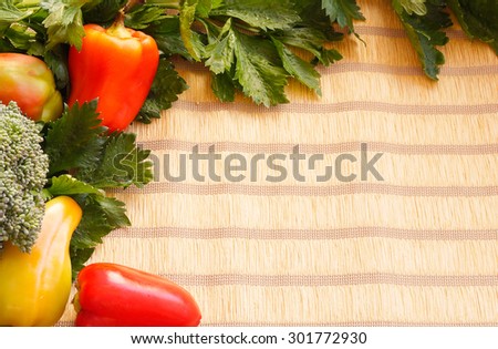 Bell peppers and celery on the bamboo table mat