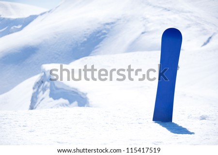 board for snowboarding in the snow on background snowy mountains of Europe