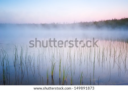 Fog over Lake. Water in the lake cools down because of the cool nights