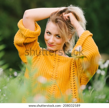 Portrait of beautiful woman on nature. The strength and health from nature
