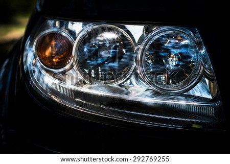 car headlight closeup, components and spare parts of the car, maintenance and tuning
