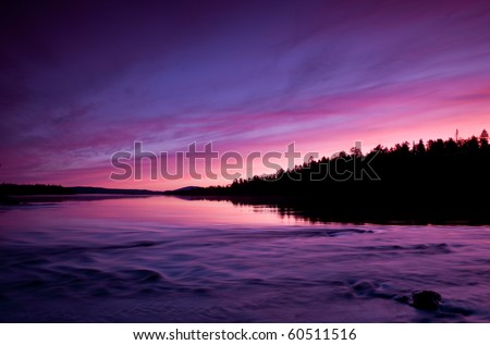 Pristine nature of the Russian North, beautiful sunset over the lake. North Karelia