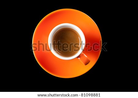 Espresso coffee in a cup of orange on a white background, top view