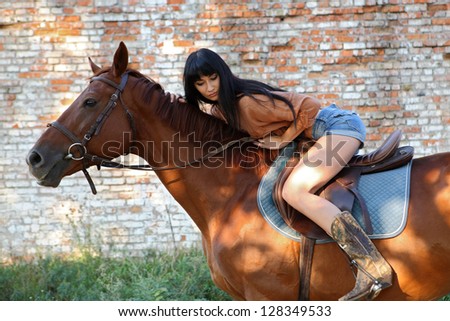 horsewoman walking his horse