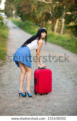 Young woman hitchhiking