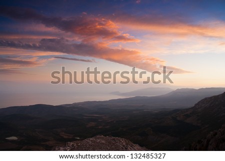 The last rays of the sun light up the valley of the Crimean mountains. Ukraine.