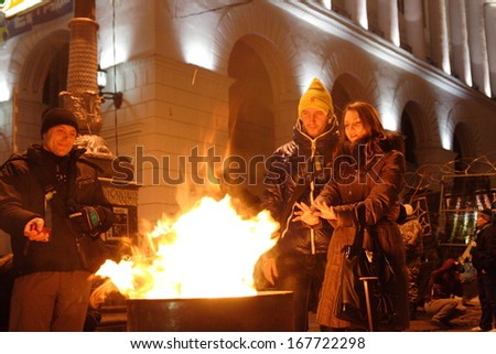KIEV, UKRAINE-DECEMBER 5, 2013:Independence Square in Kiev, Ukraine. Protesters are heated by the fire.