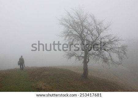 A man goes into the fog