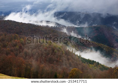 Clouds rise above the valleys in the Carpathians