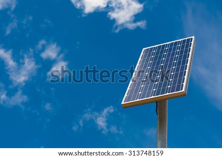 Solar panel against a blue sky with light clouds