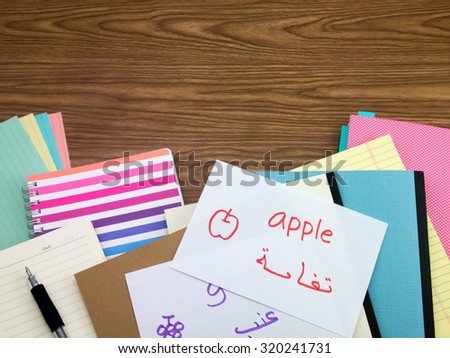 Arabic; Learning New Language Writing Words on the Notebook