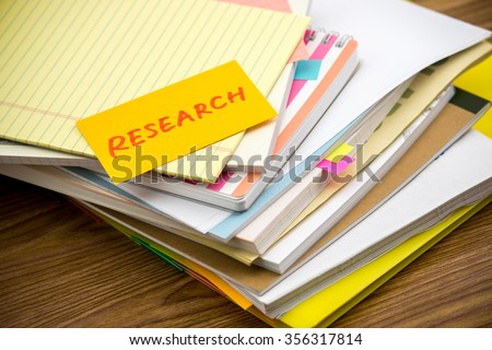 Research; The Pile of Business Documents on the Desk