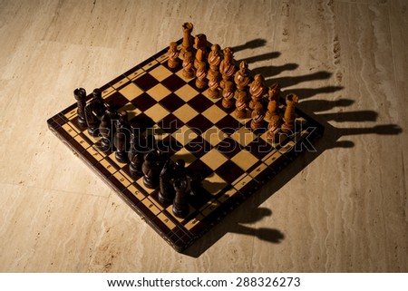 Chess board on travertine floor