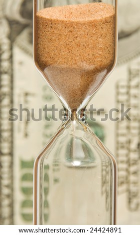 Time - money.  hourglass on the background money.