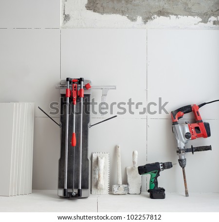 construction tools as tiles cutter electric hammer drill and trowels