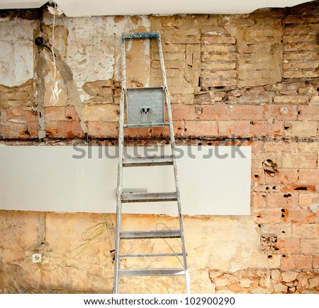demolition debris in kitchen interior construction and ladder
