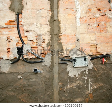 electrical and plumbing installation in kitchen interior construction