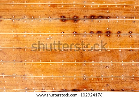 boat wooden hull texture detail with caulking putty and screw