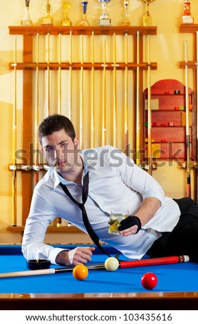 Billiard handsome player man drinking some alcohol in club