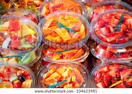 Colorful natural fruit salad transparent glasses in a row