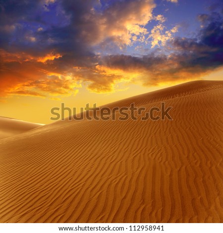 Desert sand dunes in Maspalomas sunset Gran Canaria at Canary islands [Photo illustration]