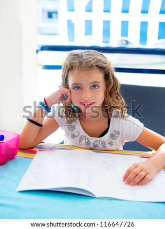 children kid girl smiling with homework in summer holding pencil