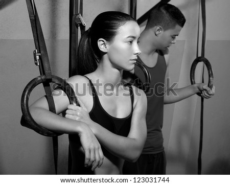 dip ring man and woman relaxed after workout at gym dipping exercise