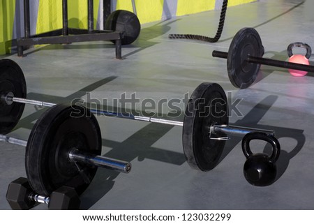 Kettlebells at gym with lifting bar weights fitness equipment