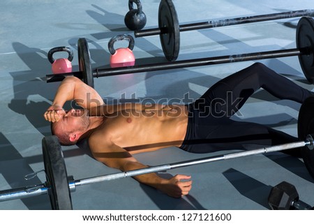 Fitness man tired relaxed after workout exercise