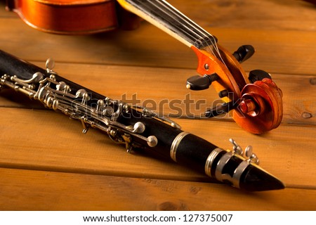 Classic music violin and clarinet in vintage wood background