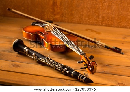 Classic music violin and clarinet in vintage wood background