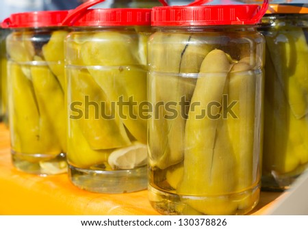 mediterranean pickled green pepper in vinegar glass pots traditional tinned food