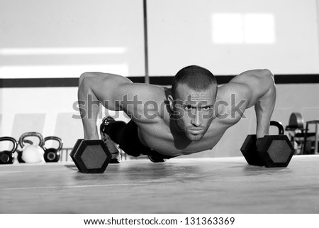 Gym Man Push-Up Strength Pushup Exercise With Dumbbell In A Crossfit Workout