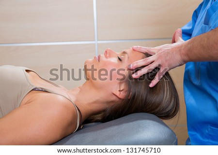 facial massage relaxing therapy on woman face with therapist hands