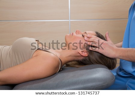 facial reflexology doctor hands in woman face therapy profile view