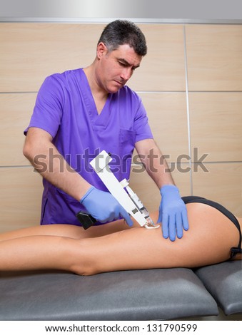 mesotherapy gun therapy for cellulite doctor with woman leg thigh