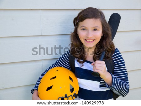 beautiful teen girl portrait with yellow helmet and baseball bat