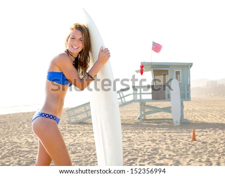 Beautiful surfer teen girl with surfboard in Santa Monica beach California Lifeguard house [ photo-illustration]