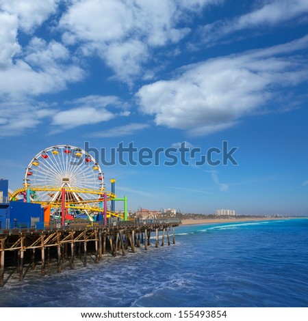 Santa Monica pier Ferris Wheel in California USA on blue Pacific Ocean