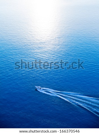 Boat Cruising Blue Mediterranean Sea Aerial View In Spain