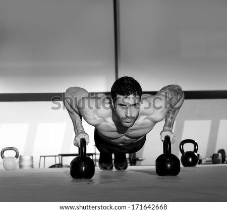 Gym Man Push-Up Strength Pushup Exercise With Kettlebell In A Crossfit Workout