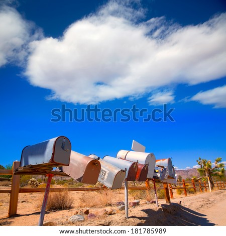 Grunge mail boxes in a row at California Mohave desert USA
