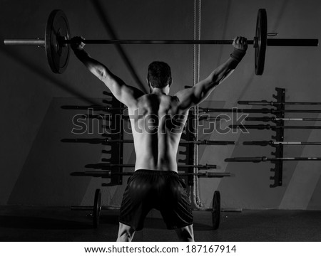 barbell weight lifting man rear view back workout exercise at gym box