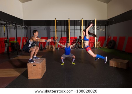 gym people group workout barbells slam balls and jump exercises