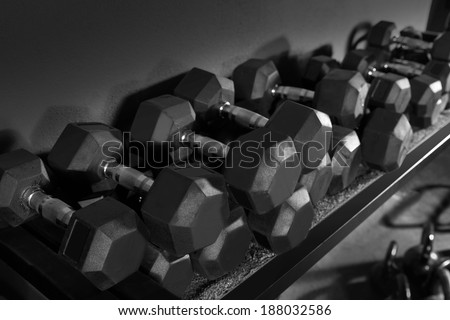 Dumbbells and Kettlebells weight training equipment at gym