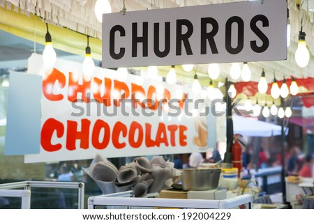 Churros and chocolate fritter typical food in Valencia Fallas fest at spain