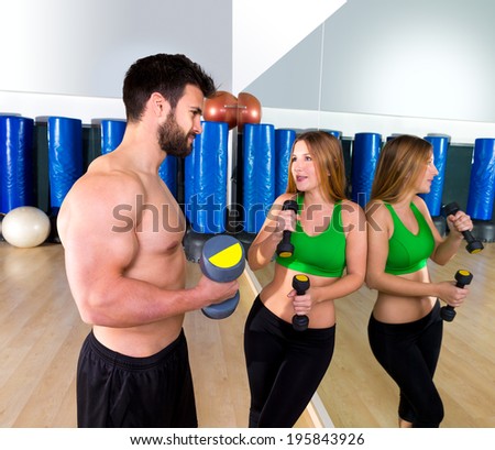 Dumbbell personal trainer man and woman talking at fitness gym