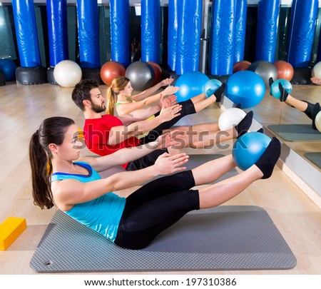Pilates softball the teaser group exercise at fitness gym