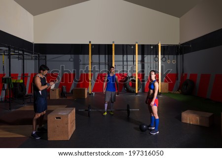 gym people group workout barbells slam balls and jump exercises